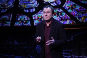 Colin Quinn in the New York production of his Long Story Short. The New York set has been downscaled a bit for his current run at the Long Wharf Theatre, which closed Aug. 21. Carol Rosegg Photo.