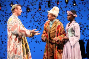 Old Shepherd Thomas Kopache flanked by Tim Brown as Florizel and Lupita Nyong'o as Perdita in The Winter's Tale at Yale Rep. Photo by Joan Marcus.